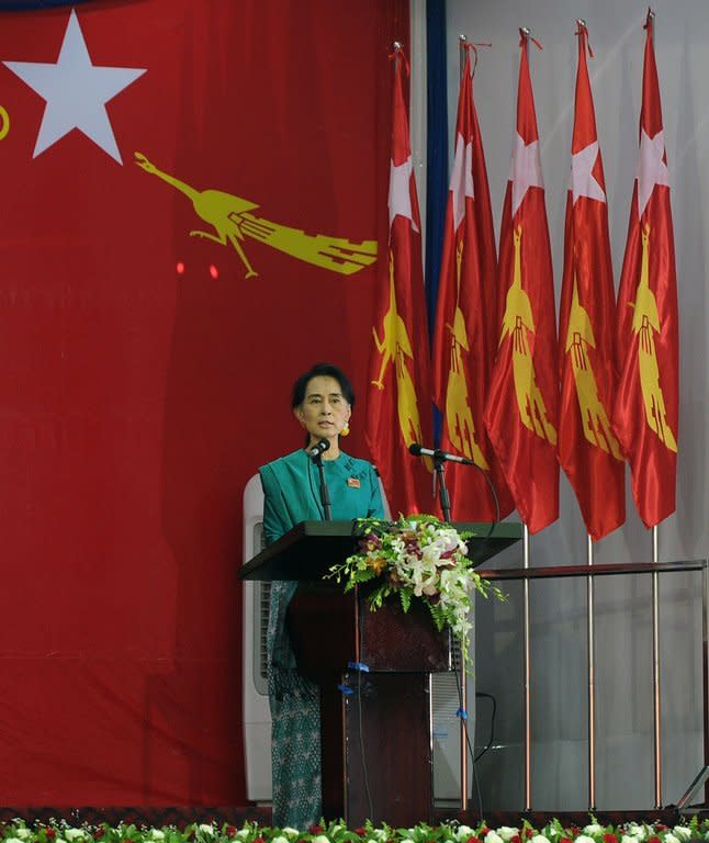 Aung San Suu Kyi delivers a speech during the National League for Democracy party conference, in Yangon, on March 9, 2013. Suu Kyi urged a revival of the "spirit of fraternity" which saw the party build a huge base during iron-fisted junta rule