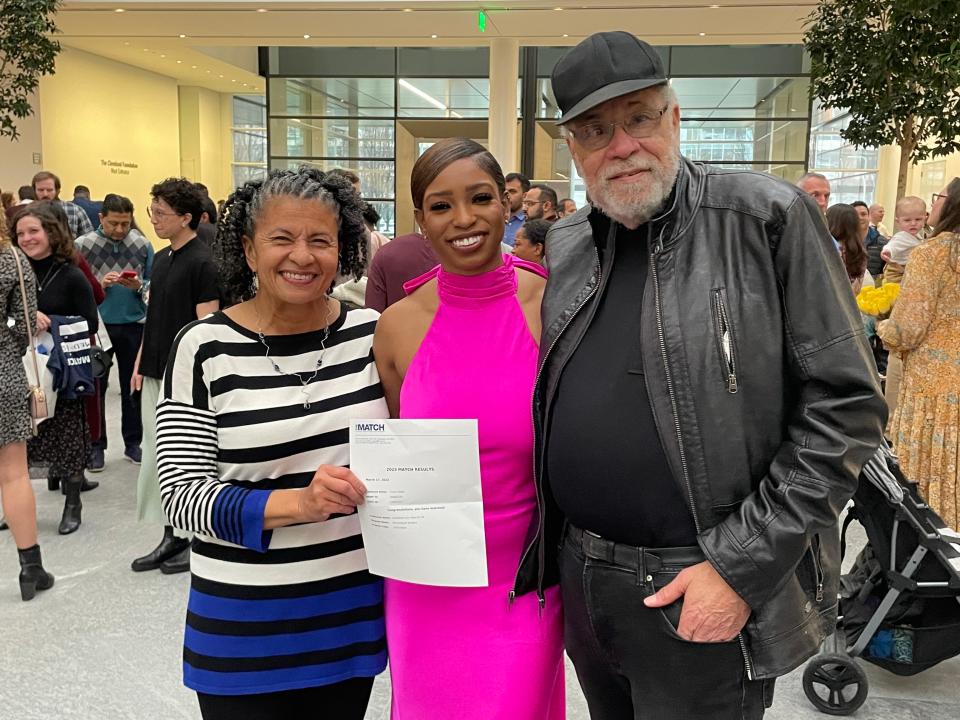 FAMU alumna Tamia Potter (middle), a current student at Case Western Reserve University's School of Medicine, takes  a photo with Dr. Edweana Robinson (left) and Dr. Robert Haynie (right) on March 17, 2023.