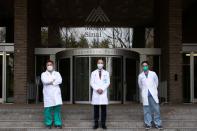 Doctors pose outside The Mount Sinai Hospital in Manhattan, New York City