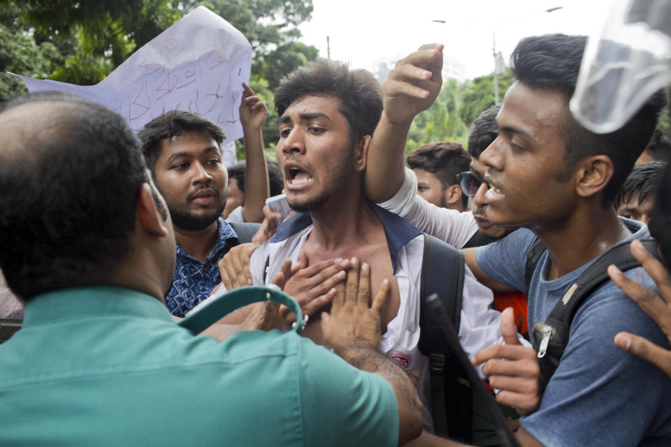 Bangladeshi students attempt to break a police barricade during a protest in Dhaka, Bangladesh, Wednesday, Aug. 1, 2018. Students blocked several main streets in the capital, protesting the death of two college students in a bus accident in Dhaka. (AP Photo/A. M. Ahad)