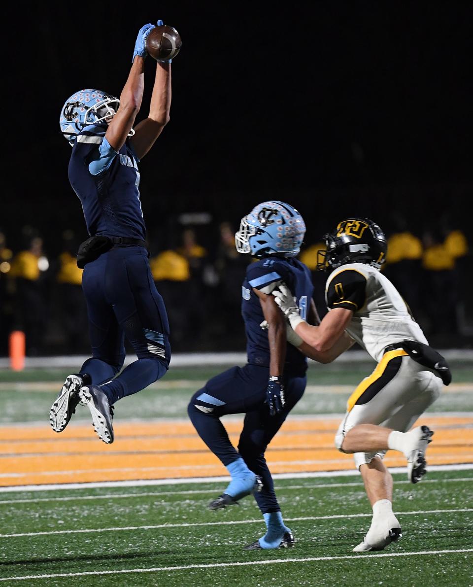 Jayvin Thompson #7 of the Central Valley Warriors intercepts a pass intended for Ryan Lawry #1 of the Thomas Jefferson Jaguars in the first half during the game at Newman Stadium on November 18, 2022 in Wexford, Pennsylvania.