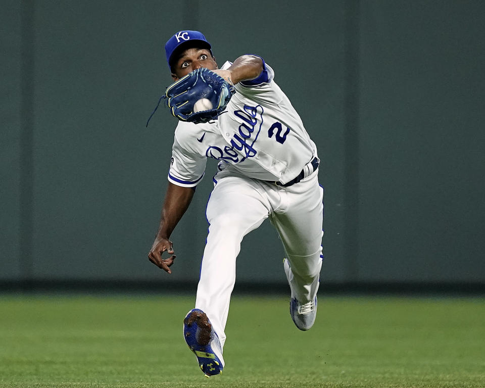 Kansas City Royals center fielder Michael A. Taylor catches a fly ball for the out on Los Angeles Angels' Shohei Ohtani during the fifth inning of a baseball game Tuesday, July 26, 2022, in Kansas City, Mo. (AP Photo/Charlie Riedel)
