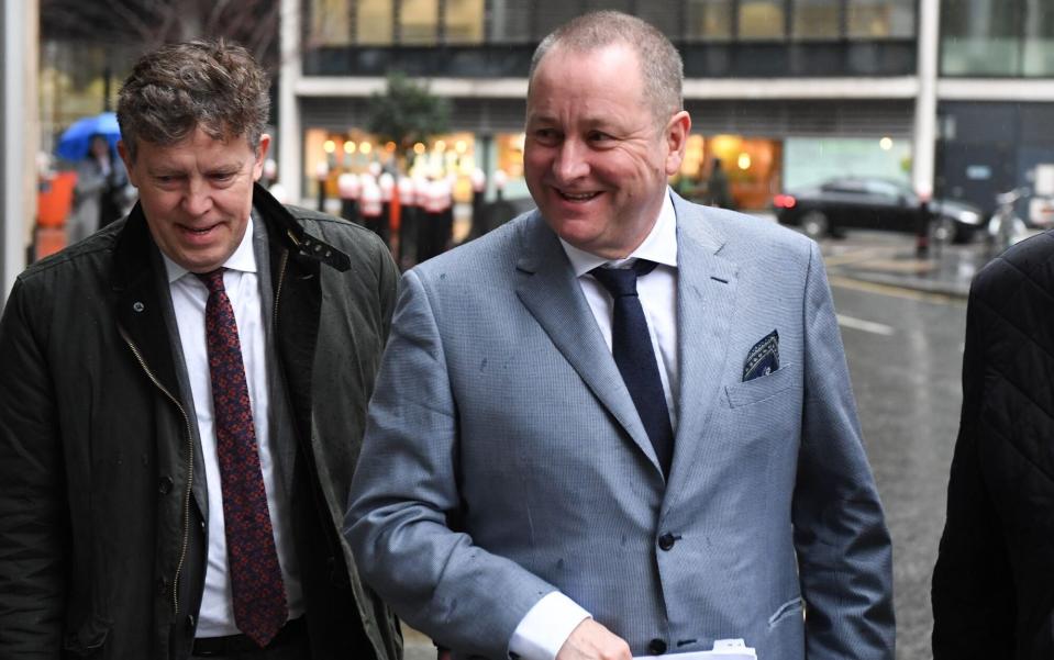 Frasers founder Mike Ashley, right, arrives at court in London