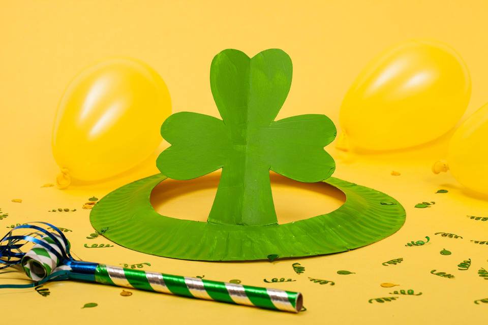 This photo provided by FamilyFun shows a shamrock hat. From leprechaun beards to shamrock hats, a few fast crafts can crank up the fun at a St. Patrick’s Day parade or party. (AP Photo/FamilyFun, Tim MacKay)