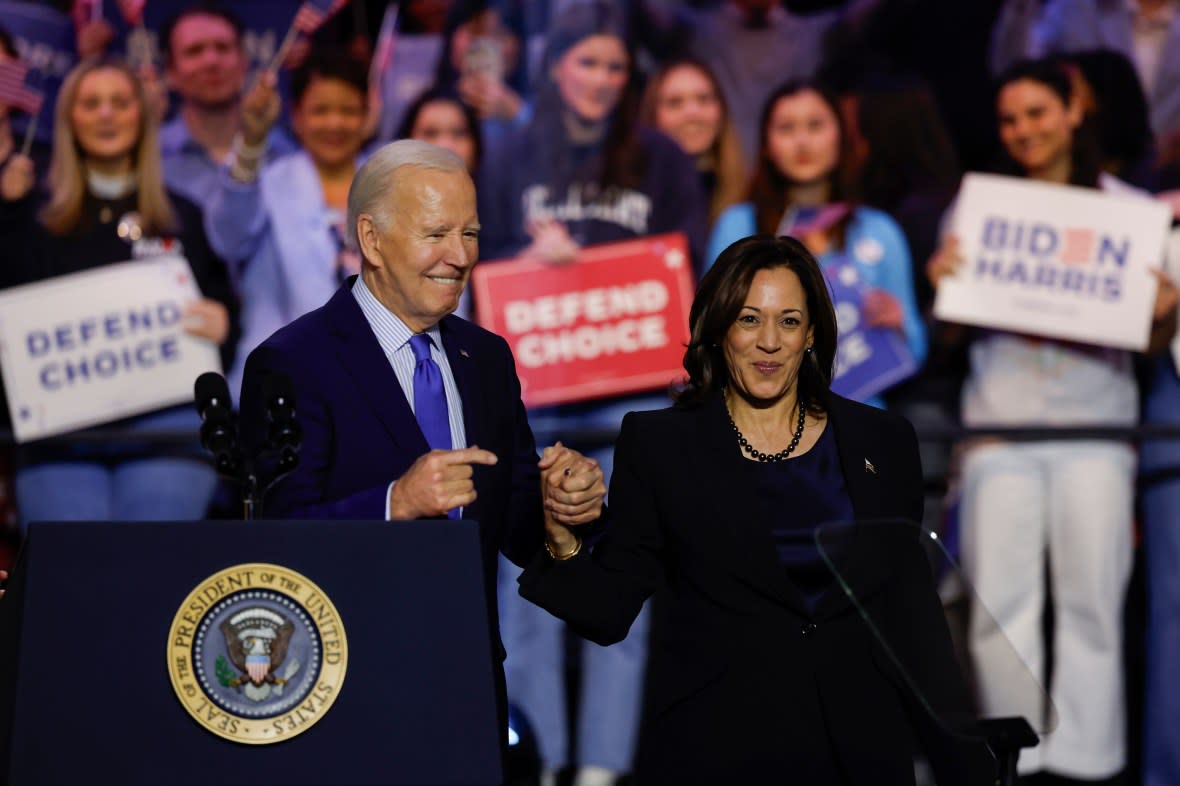 U.S. President Joe Biden and U.S. Vice President Kamala Harris stand onstage and wave to the crowd at a ”Reproductive Freedom Campaign Rally" at George Mason University on Jan. 23, 2024, in Manassas, Virginia. (Photo by Anna Moneymaker/Getty Images)