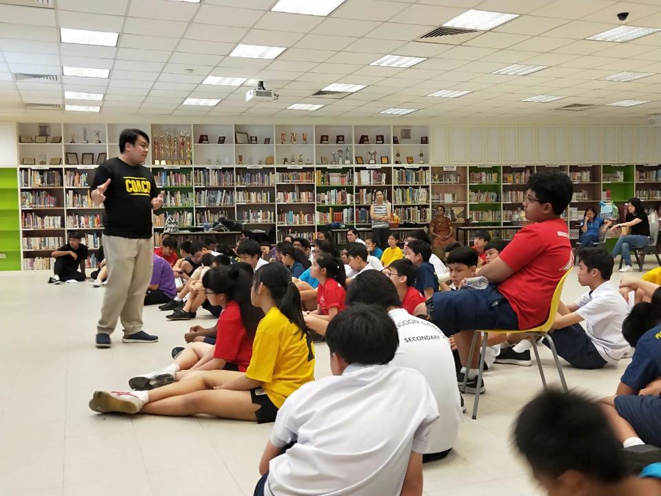 My Dollar Story co-founder Delane Lim explaining the initiative to students at Serangoon Garden Secondary School. (PHOTO: My Dollar Story/Facebook)