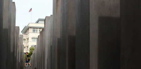 Tourists visit the Holocaust Memorial in front of the U.S. Embassy in Berlin, Germany, August 18, 2017. REUTERS/Hannibal Hanschke