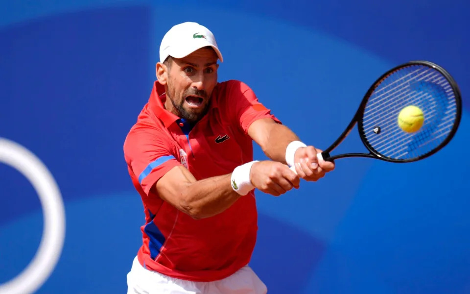 Djokovic returns a shot from Alcaraz in the finals of the men's singles tennis