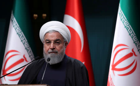 FILE PHOTO: Iranian President Hassan Rouhani speaks at a news conference after a meeting with Turkish counterpart Tayyip Erdogan in Ankara, Turkey, December 20, 2018. REUTERS/Umit Bektas/File Photo