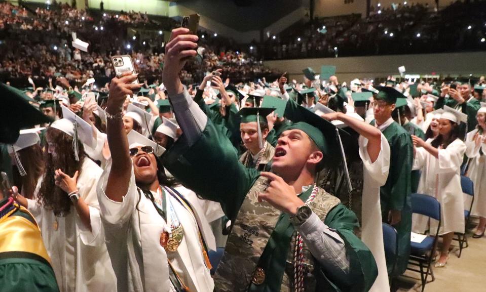 Flagler-Palm Coast High seniors react as their commencement exercises end, Saturday, May 28, 2022, at the Ocean Center.