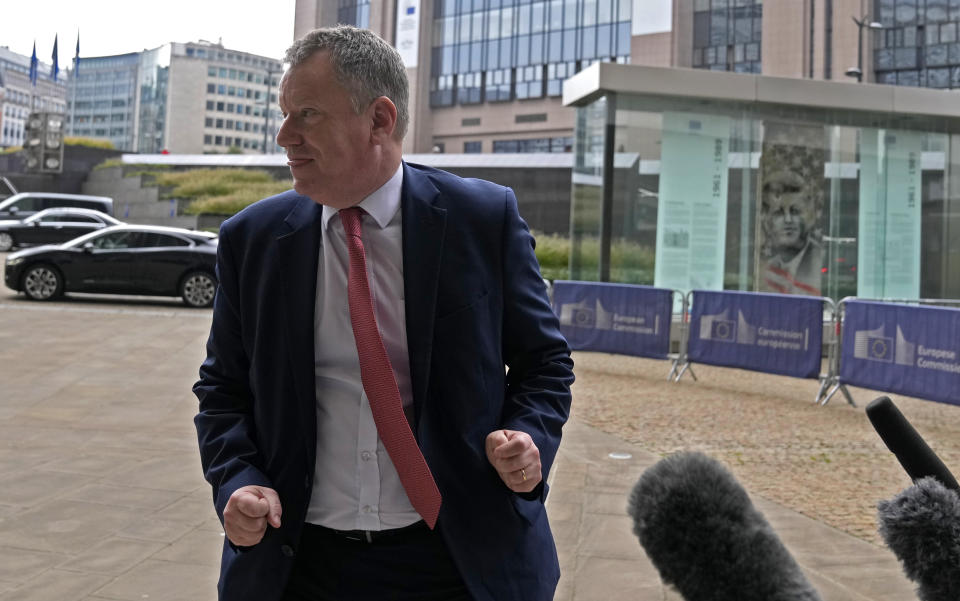 United Kingdom's Brexit minister Lord David Frost walks away after speaking with the media as he arrives for a lunch with European Commissioner for Inter-institutional Relations and Foresight Maros Sefcovic at EU headquarters in Brussels, Friday, Oct. 15, 2021. Brexit kicked into high gear again Friday, almost a year after a deal on a free trade agreement was supposed to have officially sealed the separation between the European Union and the United Kingdom. (AP Photo/Virginia Mayo)