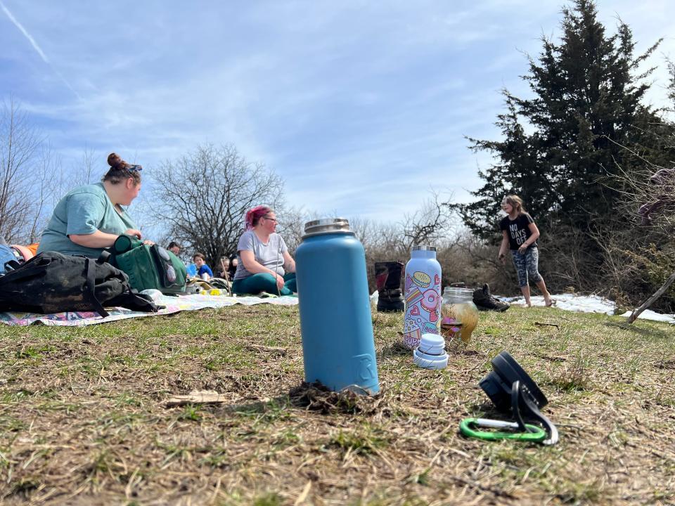 The Tower and Bell family from Monkton and Starksboro, Vermont picnic in Williston during the total solar eclipse on April 8, 2024. The family left a line of water bottles open to the air in order to make "moon water."