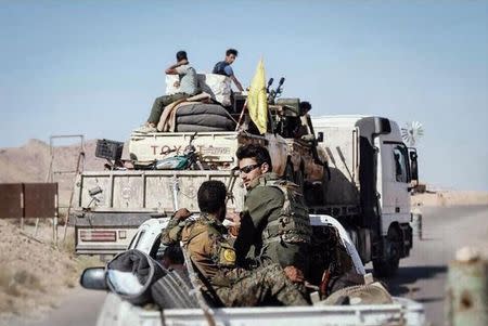 Nujaba fighters move their forces inside Syria toward the Iraqi border in this handout picture released by Tasnim News Agency on June 14, 2017. Tasnim News Agency/Handout via REUTERS