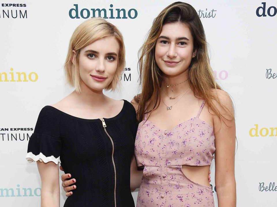 <p>Dimitrios Kambouris/Getty</p> Emma Roberts and Grace Nickels attend Domino x American Express Platinum on August 4, 2017 in Bridgehampton, New York.