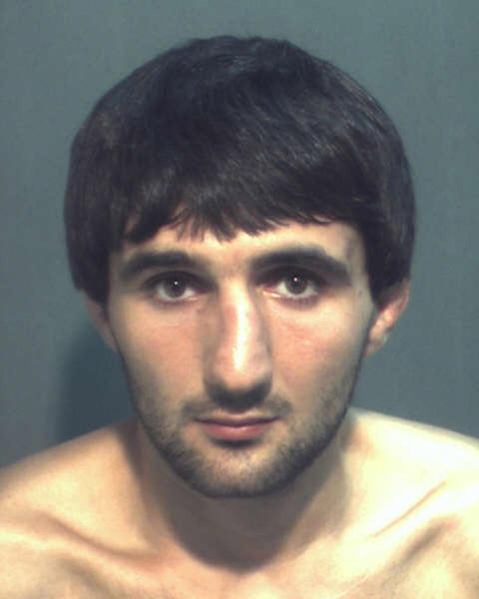 Ibragim Todashev is pictured in this undated booking photo courtesy of the Orange County Corrections Department. A Florida prosecutor on March 25, 2014 cleared of criminal wrongdoing U.S. government agents involved in the 2013 shooting death of Todashev, a Chechen immigrant who was being questioned about April's Boston Marathon bombing. REUTERS/Orange County Corrections Department/Handout via Reuters (UNITED STATES - Tags: CRIME LAW) ATTENTION EDITORS - THIS PICTURE WAS PROVIDED BY A THIRD PARTY. REUTERS IS UNABLE TO INDEPENDENTLY VERIFY THE AUTHENTICITY, CONTENT, LOCATION OR DATE OF THIS IMAGE. THIS PICTURE IS DISTRIBUTED EXACTLY AS RECEIVED BY REUTERS, AS A SERVICE TO CLIENTS. EDITORIAL USE ONLY. NOT FOR SALE FOR MARKETING OR ADVERTISING CAMPAIGNS