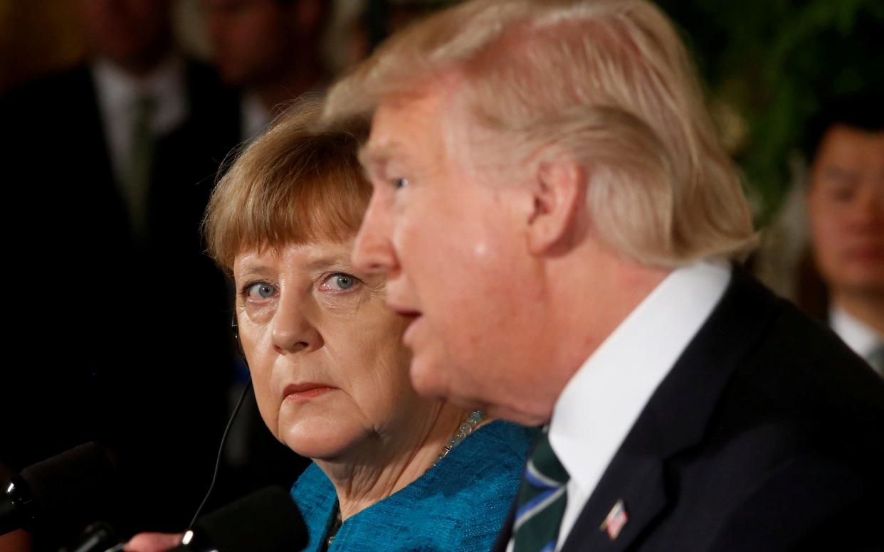 Angela Merkel and Donald Trump speak at a White House press conference - Jonathan Ernst/Reuters