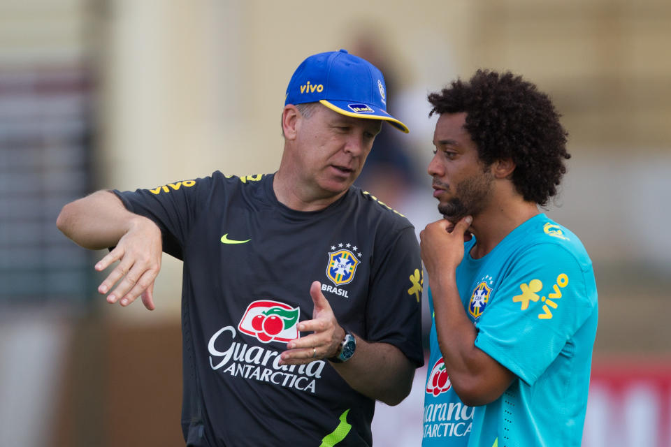Brazil's soccer coach Mano Menezes, left, gives directions to Brazil's player Marcelo during a training session in preparation for the London 2012 Olympics in Rio de Janeiro, Brazil, Wednesday July 11, 2012. (AP Photo/Felipe Dana)