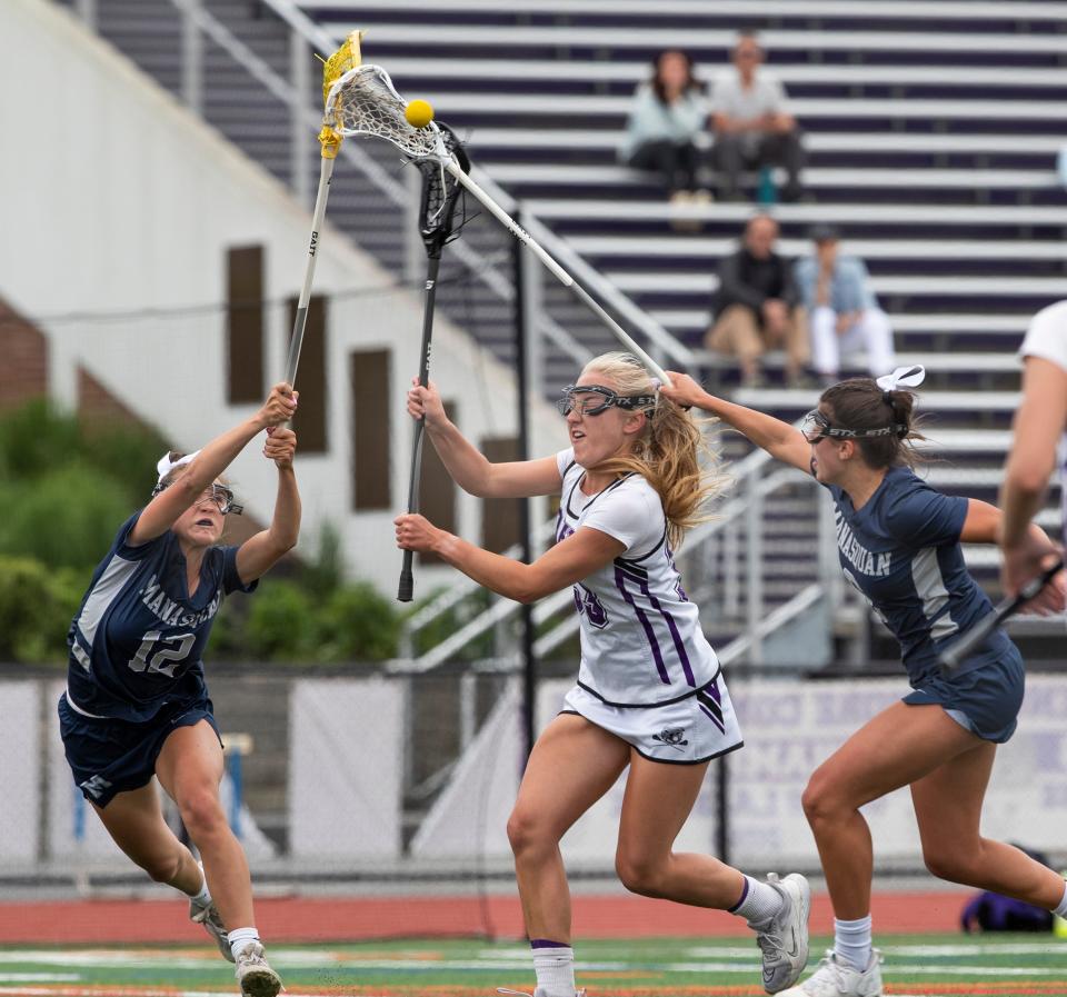 Manasquan Madeline Johnson and Ava Chiarella double team Jacqueline Braceland as she tries to shoot in first half action. Manasquan Girls Lacrosse defeats Manasquan 13-8 in NJSIAA Sectional final in Rumson, NJ on June 1, 2022.