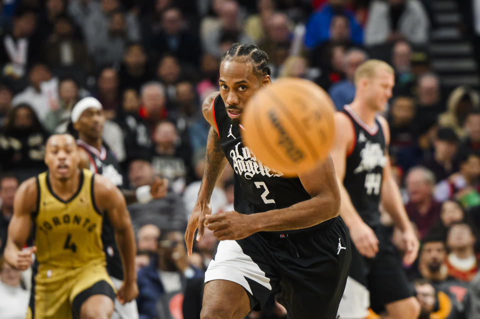 Los Angeles Clippers forward Kawhi Leonard (2) looks toward the ball during during the second half of an NBA basketball game against the Toronto Raptors in Toronto, Friday, Jan. 26, 2024. (Christopher Katsarov/The Canadian Press via AP)