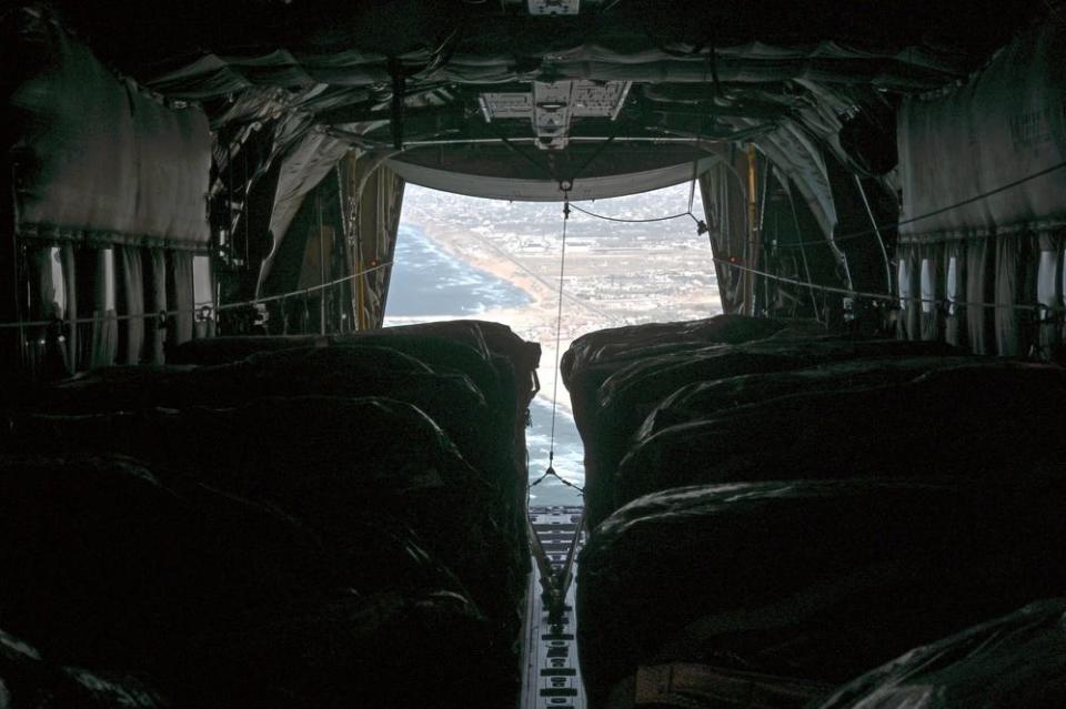 A US Air Force C-130J Super Hercules aircraft airdrops 66 pallets of food over Gaza.