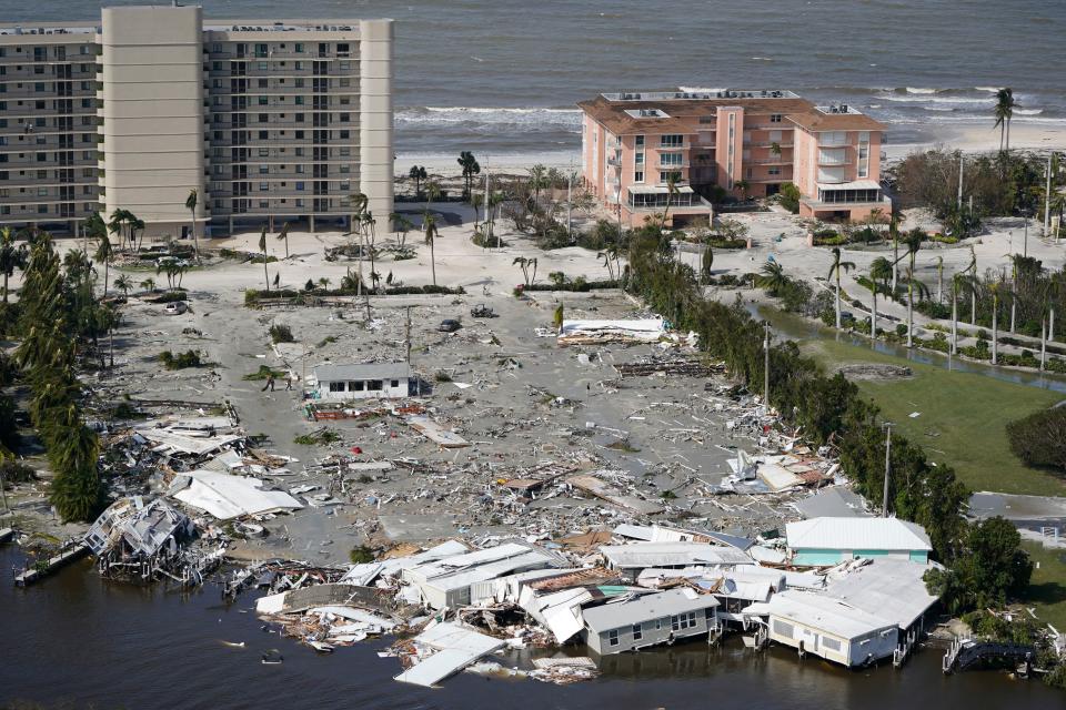 Damaged structures are seen in the wake of Hurricane Ian, Thursday, Sept. 29, 2022, in Fort Myers Beach, Fla. (AP Photo/Wilfredo Lee)