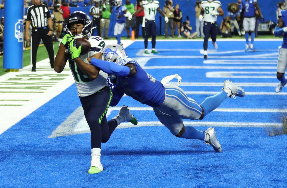 Seattle Seahawks wide receiver <a class="link " href="https://sports.yahoo.com/nfl/players/28457" data-i13n="sec:content-canvas;subsec:anchor_text;elm:context_link" data-ylk="slk:Tyler Lockett;sec:content-canvas;subsec:anchor_text;elm:context_link;itc:0">Tyler Lockett</a> catches a touchdown pass against Detroit Lions cornerback Jerry Jacobs during the second half Sunday, Sept. 17, 2023.