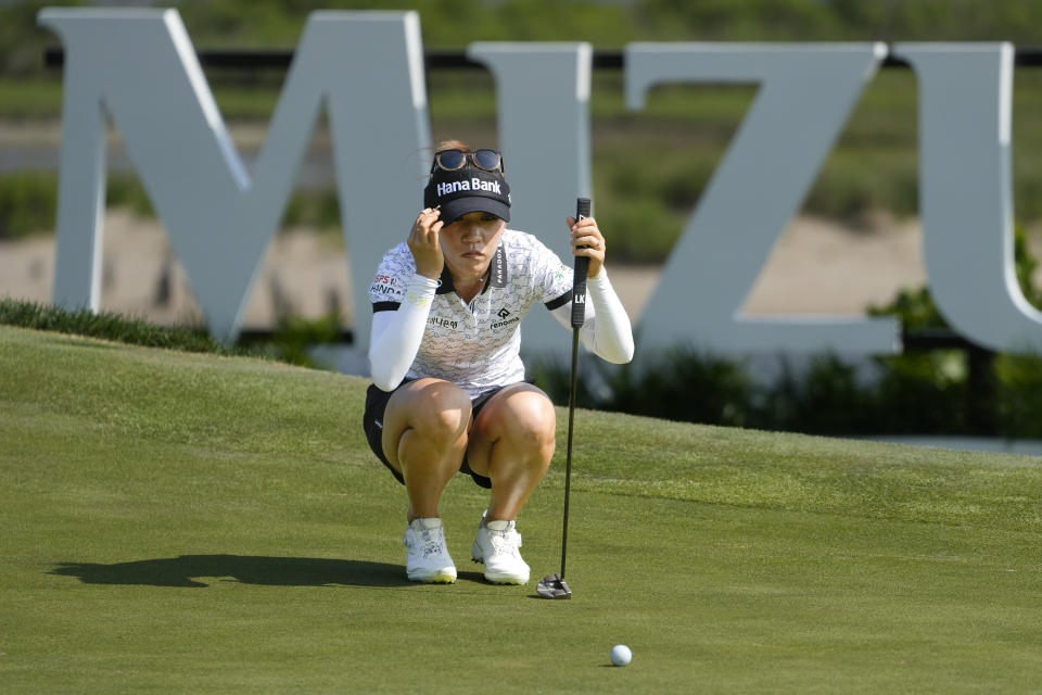 Lydia Ko, of New Zealand, sets up her putt on the 18th green during the first round of the Mizuho Americas Open golf tournament, Thursday, June 1, 2023, at Liberty National Golf Course in Jersey City, N.J. (AP Photo/John Minchillo)