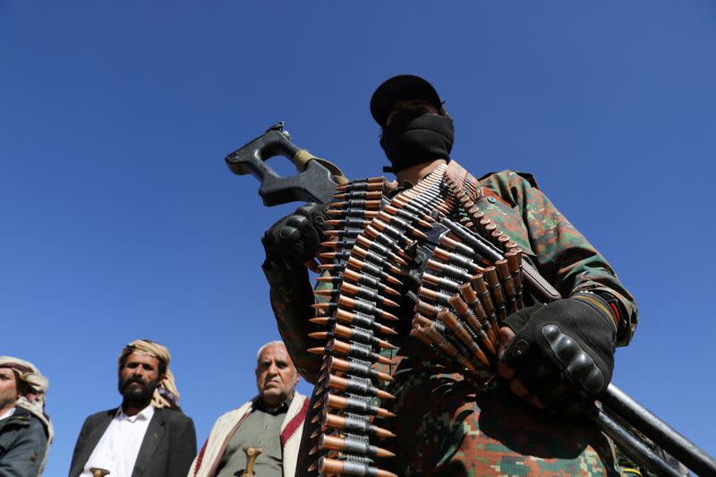 FILE PHOTO: Houthi policeman takes part in a protest against recent U.S.-led strikes on Houthi targets, near Sanaa