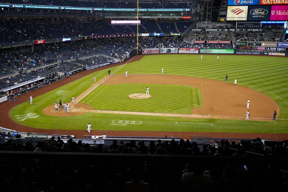 Fans watch as Baltimore Orioles' Anthony Santander runs the bases after hitting a three-run home run during the sixth inning of a baseball game against the New York Yankees, Tuesday, April 26, 2022, in New York. (AP Photo/Frank Franklin II)