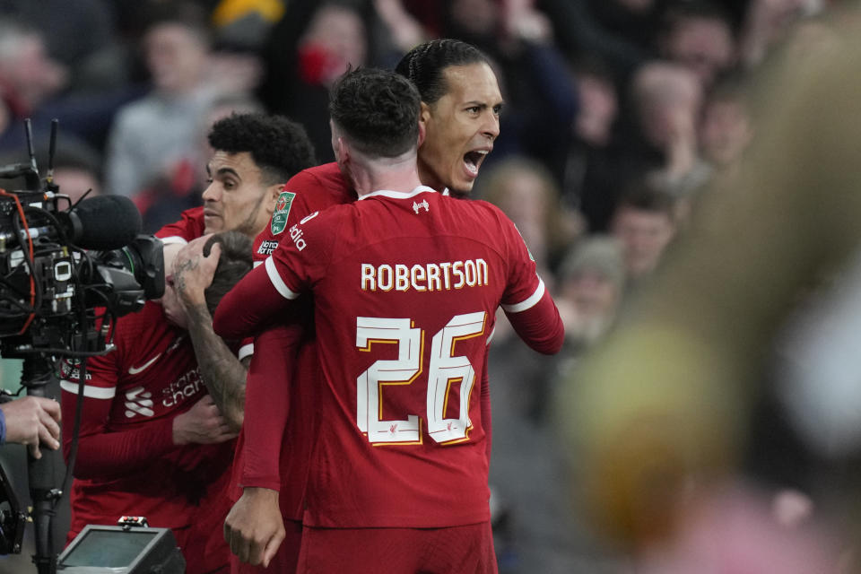 Liverpool's Virgil van Dijk celebrates scoring a goal that was disallowed during the English League Cup final soccer match between Chelsea and Liverpool at Wembley Stadium in London, Sunday, Feb. 25, 2024. (AP Photo/Alastair Grant)