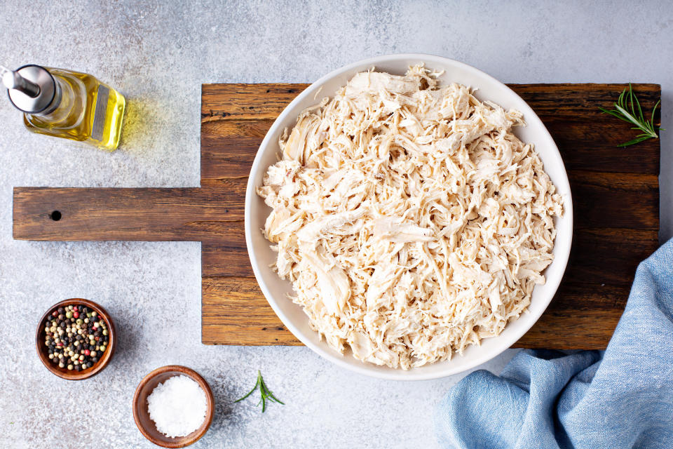 Shredded chicken meat in a big bowl.