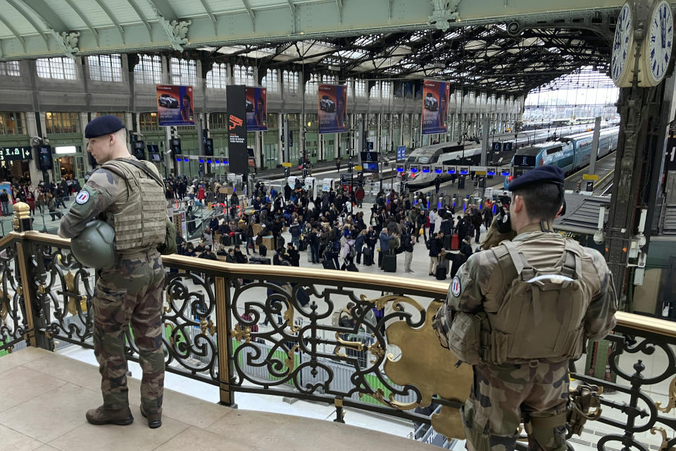 Soldiers patrol inside the Gare de Lyon station after an attack, Saturday, Feb. 3, 2024 in Paris. A man injured three people Saturday in a stabbing attack at the major Gare de Lyon train station in Paris, another nerve-rattling security incident in the Olympic host city before the Summer Games open in six months. (AP Photo/Christophe Ena)