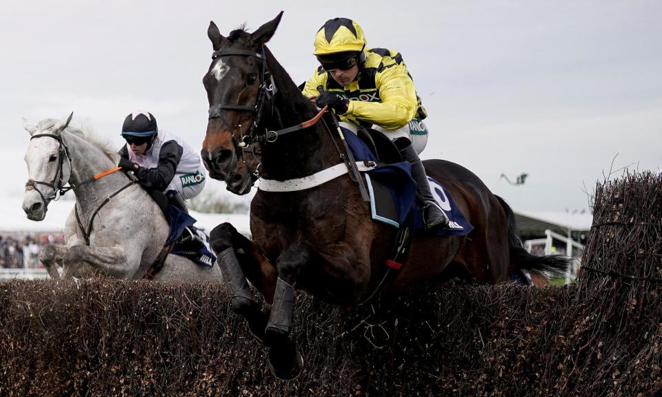<span>Nico de Boinville rides Shishkin (yellow) at Aintree’s Grand National meeting last month.</span><span>Photograph: Alan Crowhurst/Getty Images</span>