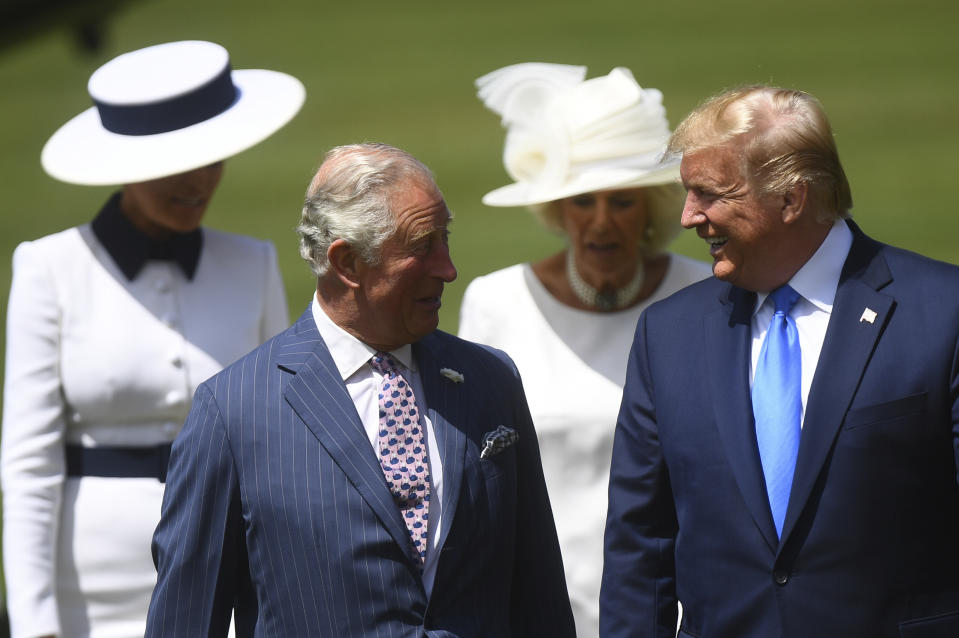 FILE - President Donald Trump, right, and first Lady Melania Trump, left, attend a welcome ceremony with Britain's Prince Charles and Camilla, Duchess of Cornwall in the garden of Buckingham Palace, in London, June 3, 2019. (Victoria Jones/Pool via AP, File)