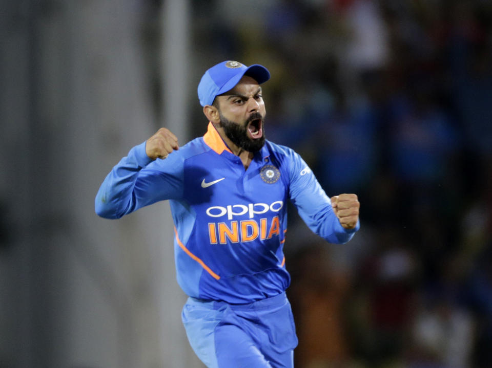 FILE - In this March 5, 2019 file photo, India's Virat Kohli celebrates Australian batsman Peter Handscomb's wicket during the second one-day international cricket match between India and Australia in Nagpur, India. The 2019 Cricket World Cup starts in England on May 31. (AP Photo/Rajanish Kakade, File)