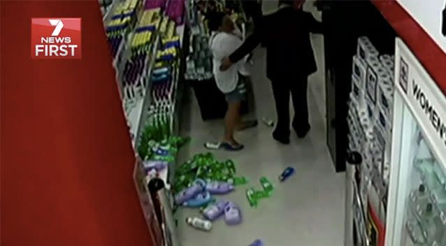 Ms Holmes wiped out a shelf of bottles in anger. Source: 7 News