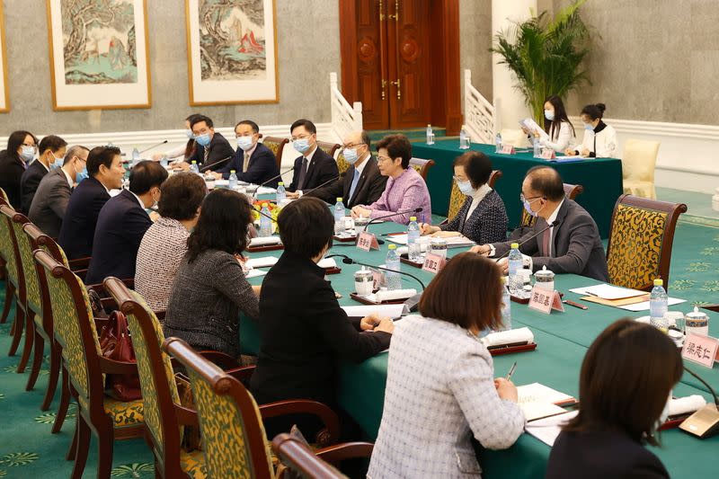 Hong Kong's Chief Executive Carrie Lam meets Chinese Commerce Minister Zhong Shan and other officials in Beijing