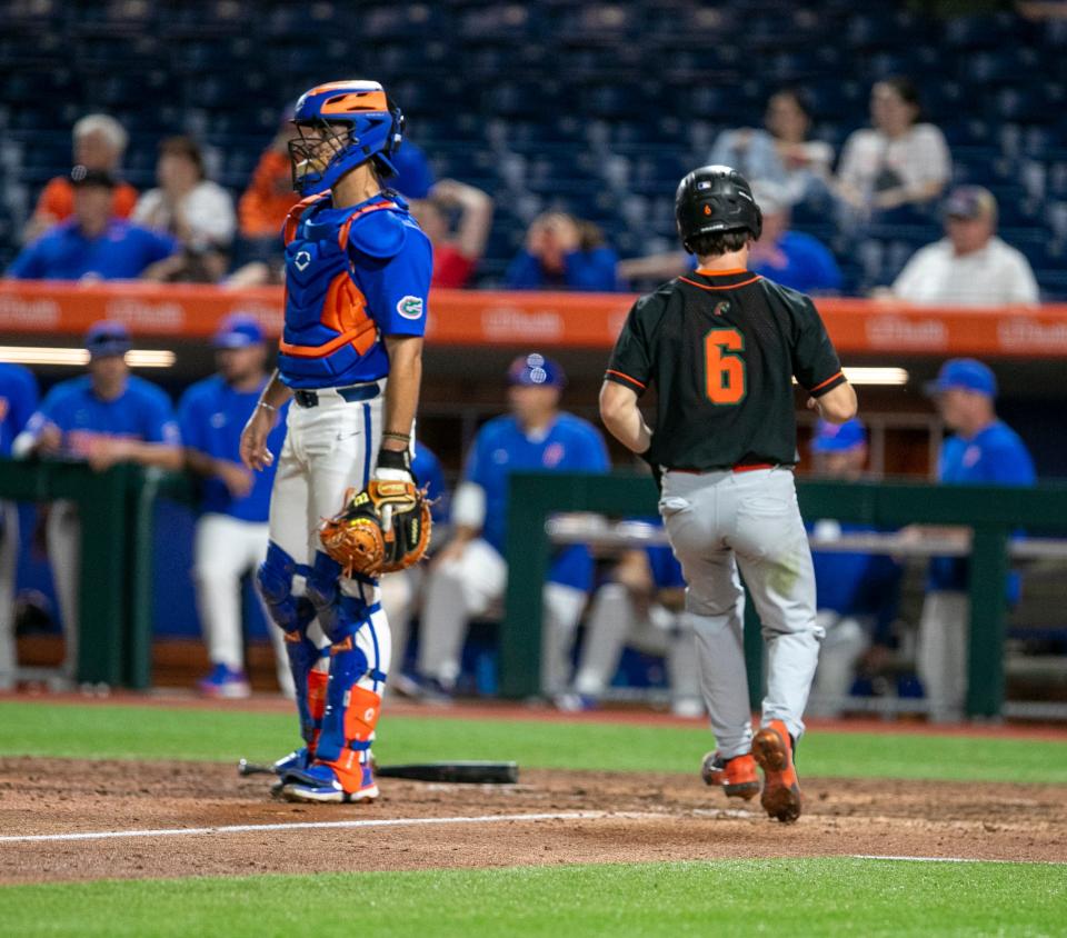 Florida A&M's catcher Broedy Poppell (6) scores off Florida A&M's outfielder Zeddric Burnham (21) RBI single in the top of the eighth inning in the match-up against Florida, Tuesday, April 5, 2022, at Florida Ballpark in Gainesville, Florida. The Gators won 13-3. [Cyndi Chambers/ Gainesville Sun] 2022