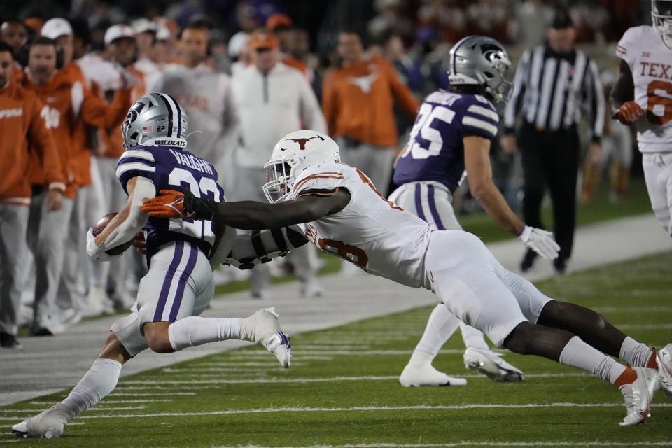 Texas defensive end Ovie Oghoufo lunges to tackle Kansas State running back Deuce Vaughn during the Longhorns' win Nov. 5 in Manhattan, Kan. The defense, coming off an impressive performance last week against TCU, could have its hands full with Kansas this week.