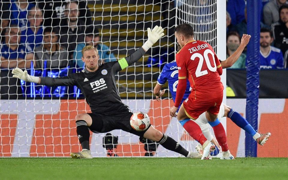 Leicester City's Danish goalkeeper Kasper Schmeichel (L) saves a shot from Napoli's Polish midfielder Piotr Zielinski  - OLI SCARFF/AFP via Getty Images