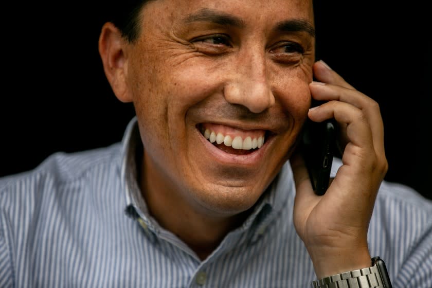 SAN DIEGO, CA - NOVEMBER 05: Todd Gloria, who is on track to be mayor-elect of San Diego, takes a phone call outside his home on Thursday, Nov. 5, 2020 in San Diego, CA. (Sam Hodgson / The San Diego Union-Tribune)`