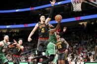 Jan 19, 2019; Atlanta, GA, USA; Boston Celtics guard Kyrie Irving (11) shoots past Atlanta Hawks center Alex Len (25) in the fourth quarter at State Farm Arena. Mandatory Credit: Brett Davis-USA TODAY Sports