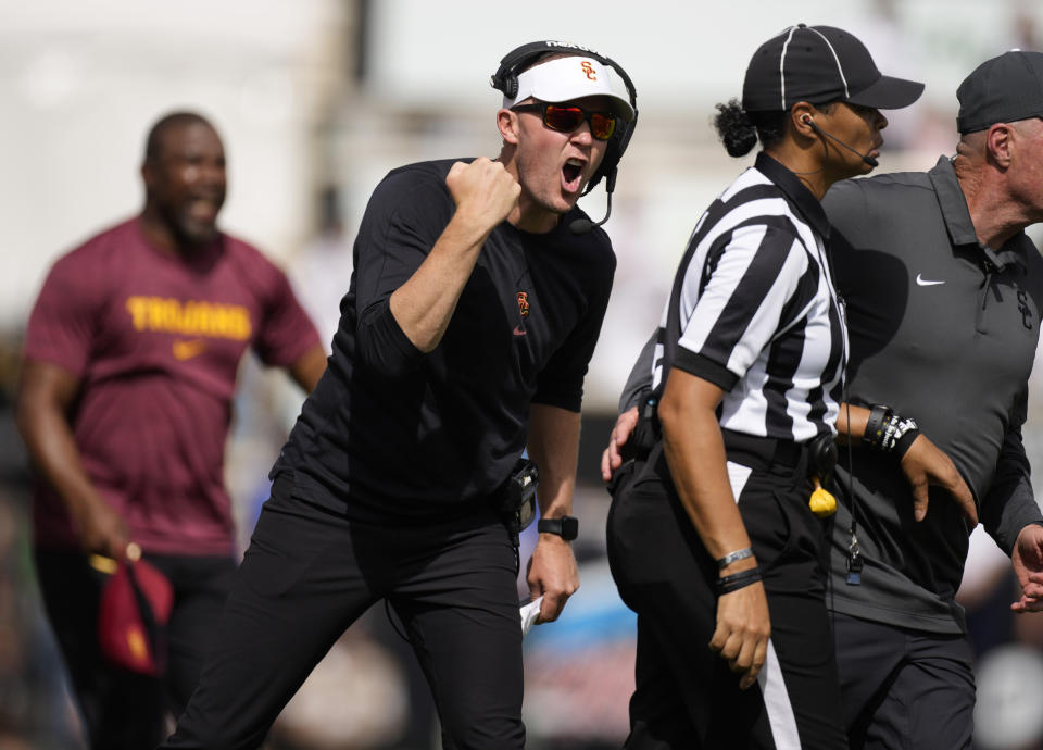 Southern California head coach Lincoln Riley, front left, yells at a referee for a call in the second half of an NCAA college football game against Colorado, Saturday, Sept. 30, 2023, in Boulder, Colo. (AP Photo/David Zalubowski)