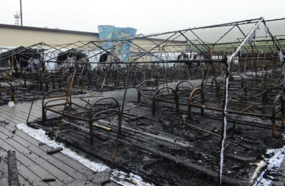 In this photo provided by Russian Emergency Situations Ministry for the Khabarovsk Region Press Service, a tent camp is seen after a fire near Solnechny village, Khabarovsk Region, Russia, Thursday, June 27, 2019. Russian authorities say three children have died in a fire at the tent camp in a ski area in the Khabarovsk region about 6,000 kilometers (3.700 miles) east of Moscow, that housed some 189 people at the time of the fire, news reports said. (Ministry of Emergency Situations for Khabarovsk Region Press Service via AP)