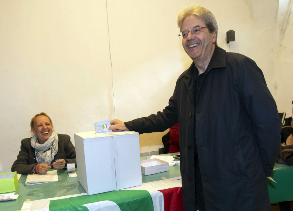 Former Italian Premier Paolo Gentiloni casts his ballot in the vote for the primary elections of the Democratic Party, in Rome, Sunday, March 3 2019. (Angelo Carconi/ANSA via AP)