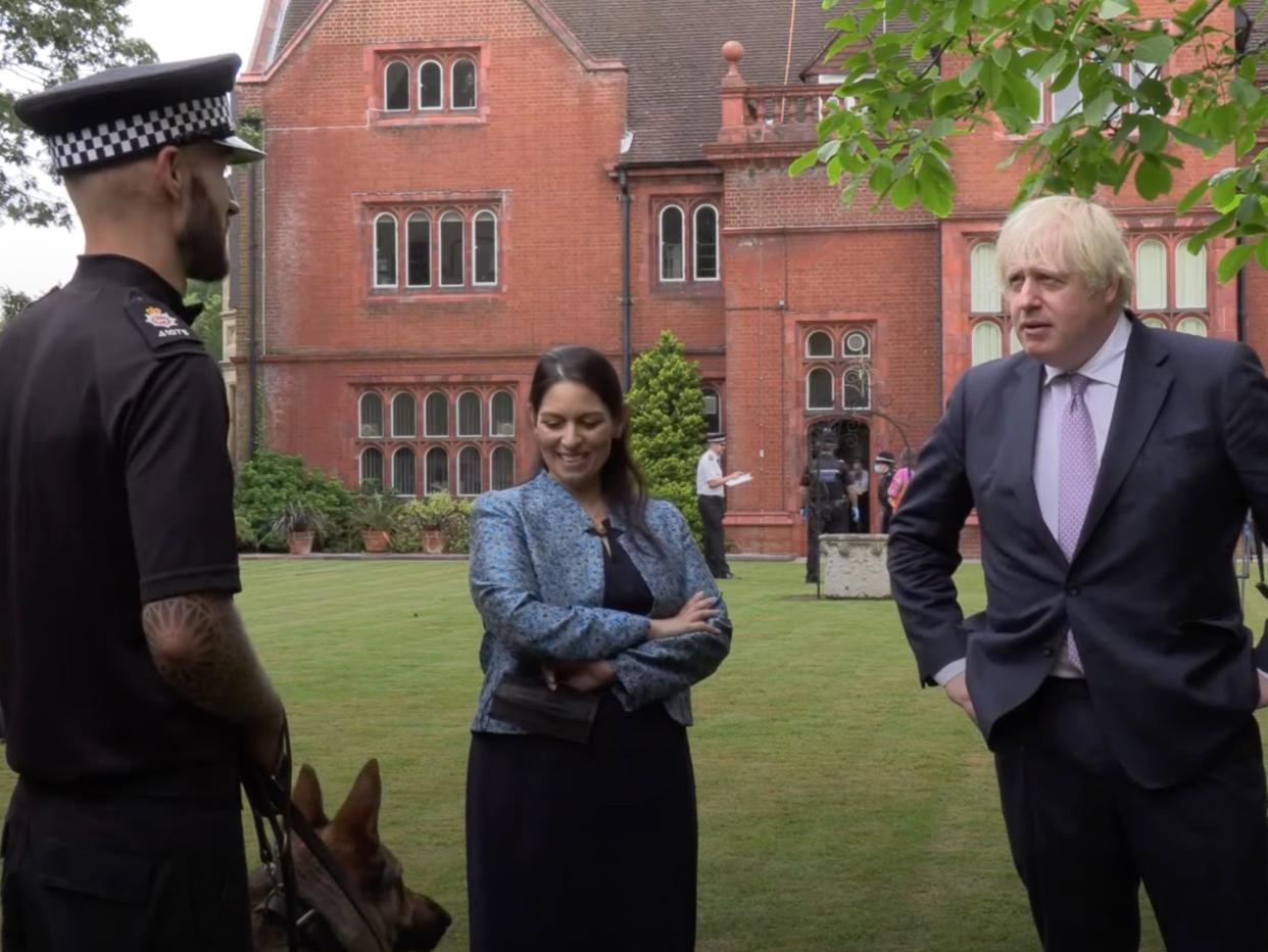 The prime minister and home secretary on a visit to Surrey Police HQ  (YouTube )