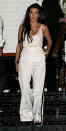 <p>The reality TV star looked white hot for a night out in Los Angeles. For the occasion, Kardashian opted for a white House of CB bodysuit ($73; <a rel="nofollow noopener" href="http://www.houseofcb.com/luca-white-seamless-knit-stretch-bodysuit-us.html" target="_blank" data-ylk="slk:houseofcb.com;elm:context_link;itc:0;sec:content-canvas" class="link ">houseofcb.com</a>) worn under a corset-like top that she paired with coordinating wide-leg trousers. She completed her ensemble with delicate jewelry, a mini clutch bag, and towering stiletto heels.</p>