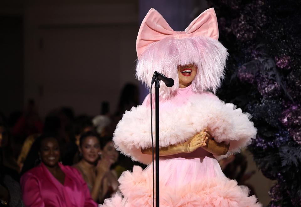 Sia performs on the runway during the Christian Siriano runway show at The Pierre Hotel on Sept. 8, 2023, in New York City.