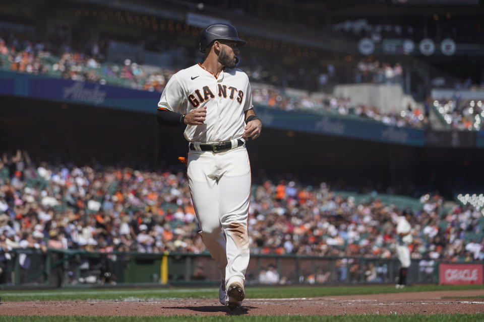 San Francisco Giants' David Villar scores against the Atlanta Braves on a double by J.D. Davis during the fourth inning of a baseball game in San Francisco, Wednesday, Sept. 14, 2022. (AP Photo/Godofredo A. Vásquez)