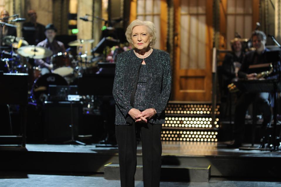 <p>The Snickers commercial was so popular that it led to a Facebook campaign called "Betty White to Host SNL (Please)" where fans begged the show to have White as a host. A few months later it was announced that White would take it on, becoming the oldest person to host <em>Saturday Night Live</em> at age 88. White told DeGeneres <a href="https://www.youtube.com/watch?v=60c9Rc0pw2c" rel="nofollow noopener" target="_blank" data-ylk="slk:in an interview;elm:context_link;itc:0;sec:content-canvas" class="link ">in an interview</a> that she had always turned down the hosting role because it was "scary." She said she was, "scared to death" to do the show. It ended up getting her an Emmy for Outstanding Guest Actress in a Comedy Series.<br></p>